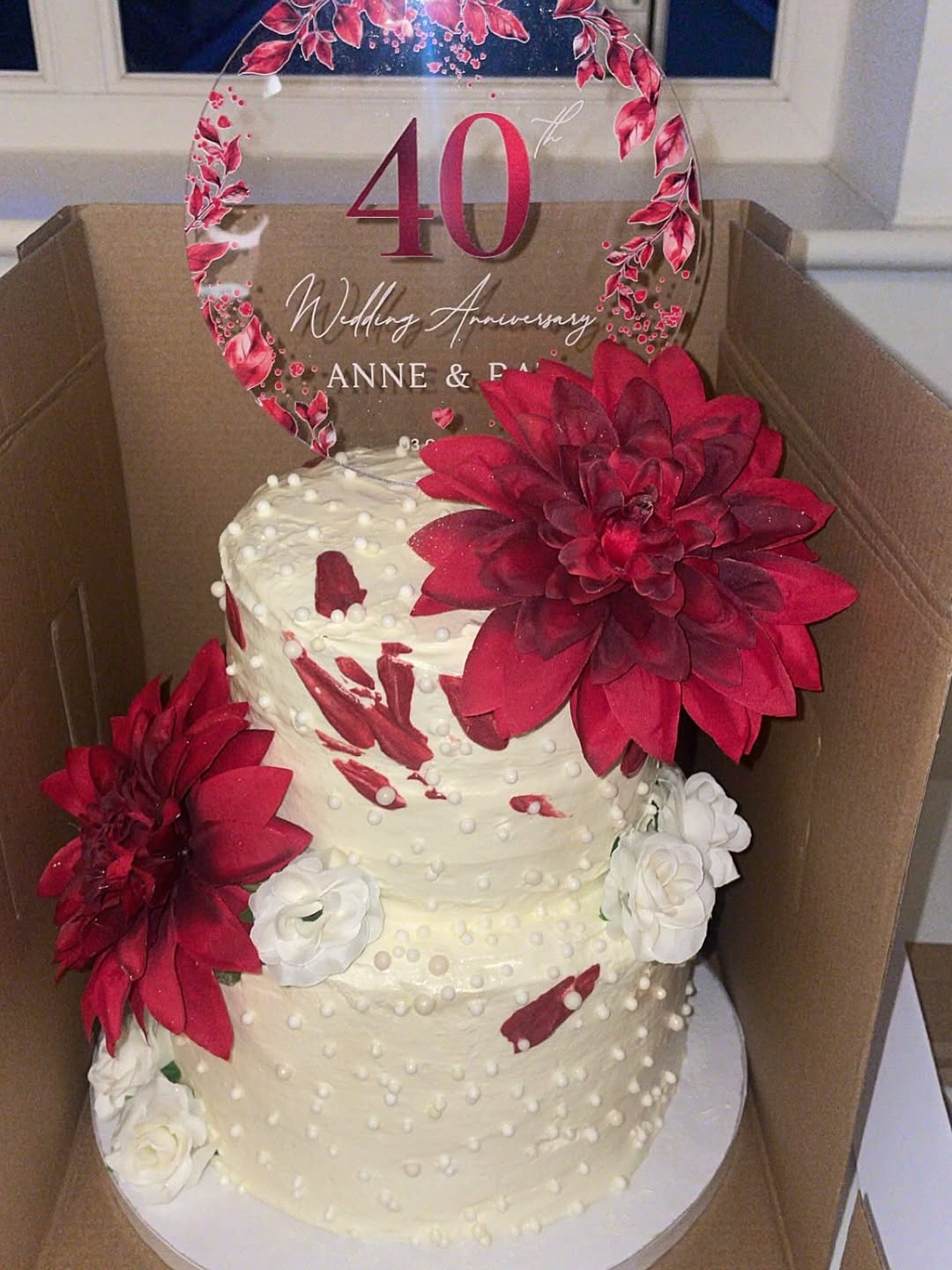 Elegant white wedding cake with floral styling